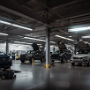 karen.reedstrom_Ford_Motors_automotive_repair_bay_with_cars_up__baff8501-3858-46a8-b065-170c09953cfa